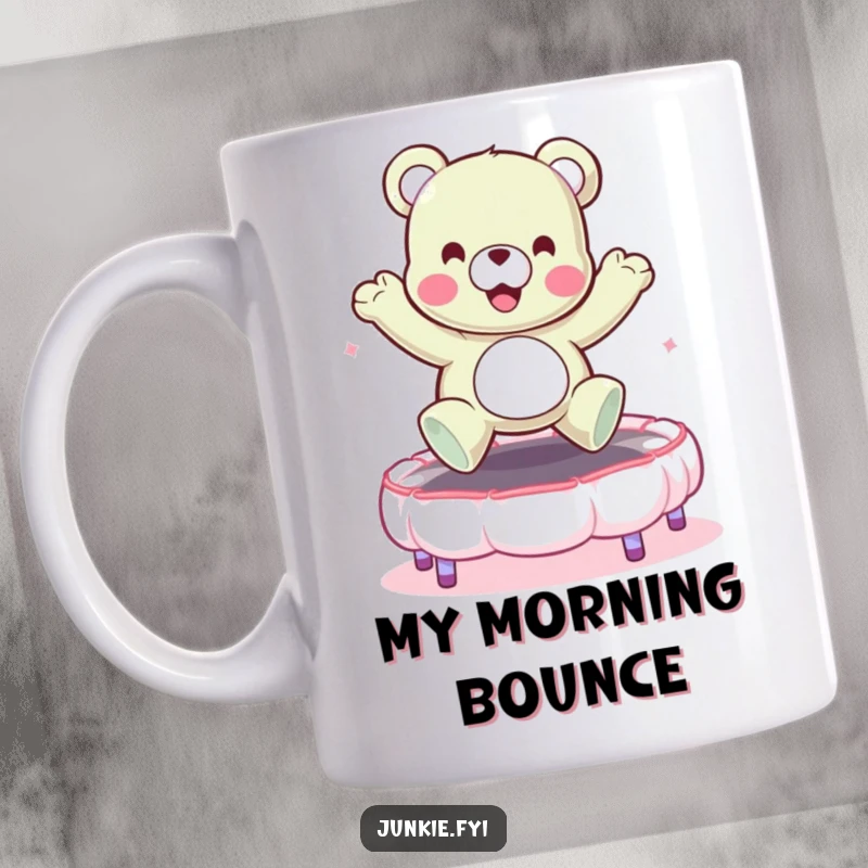 Funny mug featuring a joyful gummy bear character enthusiastically bouncing on a soft marshmallow trampoline. Pure candy fun.
