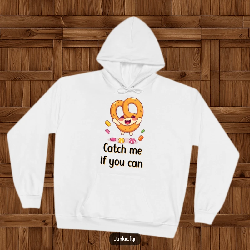 Funny pretzel character enthusiastically catching candy pieces while staying warm in a cozy hoodie, embodying playful delight.