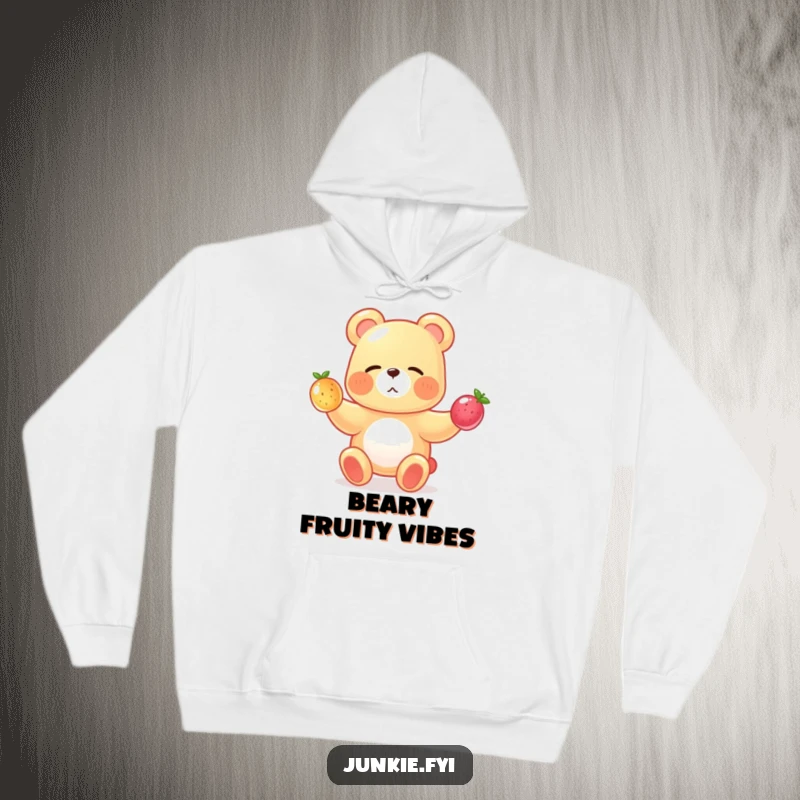 A winking gummy bear juggles tiny fruits, bringing sweet, funny vibes to this cozy hoodie.