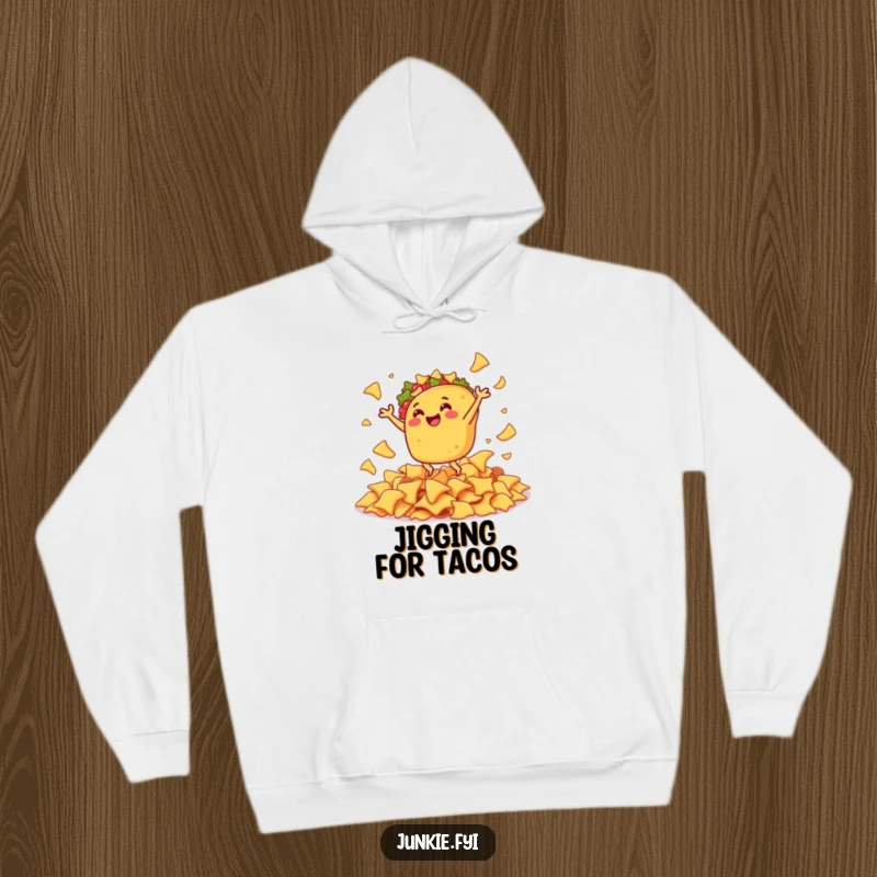 Funny hoodie featuring a gleeful taco enthusiastically doing a joyful jig amid a mountain of savory nacho chips.
