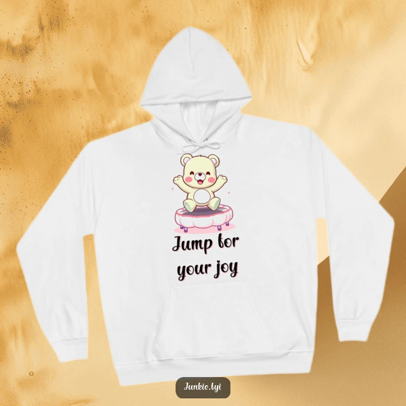 Funny hoodie print of a happy gummy bear character mid-bounce on a fluffy marshmallow trampoline. Cozy and comical.