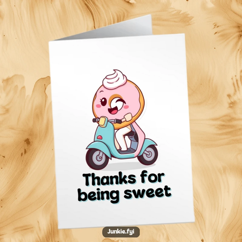 Funny Free Printable Thank You Card: A playful donut with frosting winks while riding a tiny scooter, conveying thanks.