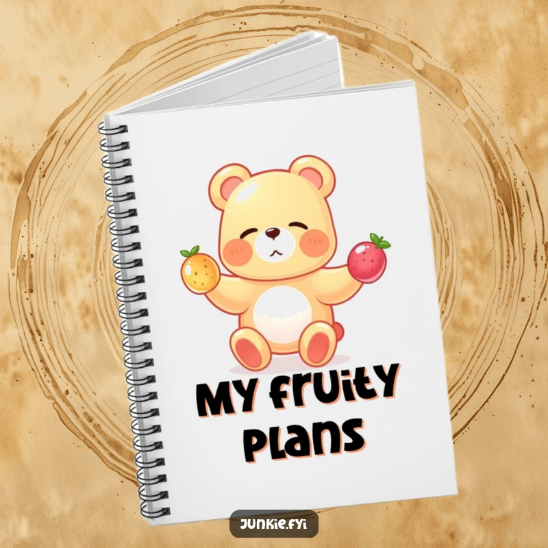 A gummy bear juggles fruits on this notebook cover, making note-taking a sweet and funny experience.